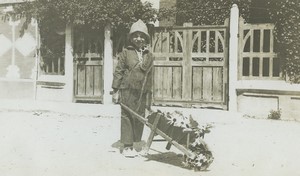 France Boy pushing flower wheelbarrow Play Game Old snapshot Photo 1950