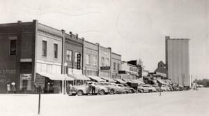 Nebraska Gordon Main street? Shops Automobiles old RPPC Photo 1952